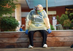 Mindy Close sitting outside Salem Health in her PPE.