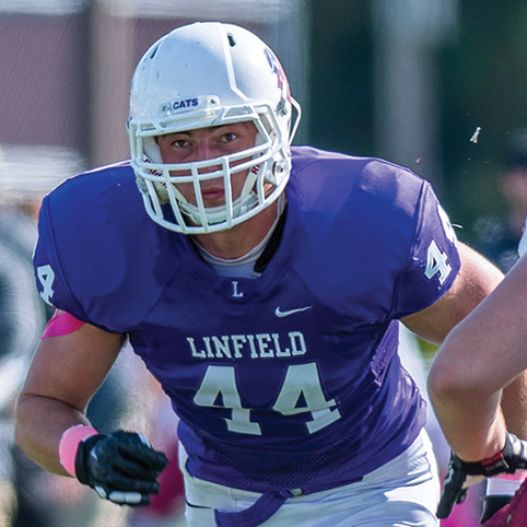 Travis Swanson '21 playing football