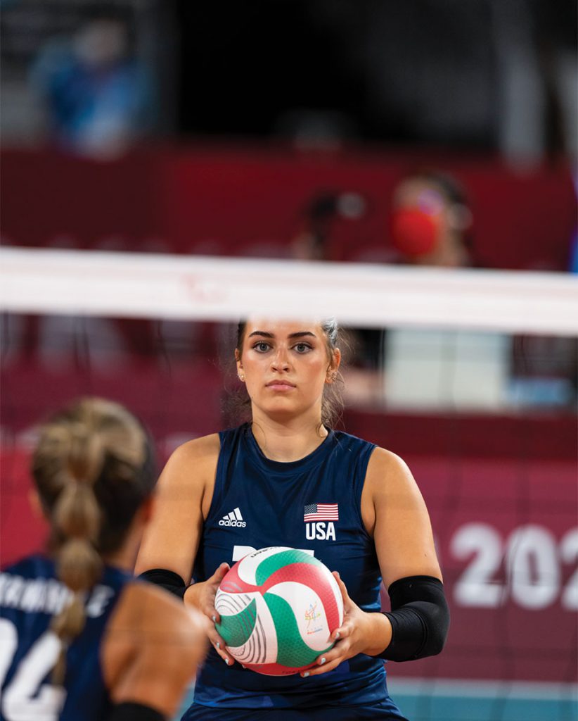 Annie Flood '25 preparing to serve on the volleyball court at the 2020 Paralympic Games in Tokyo.