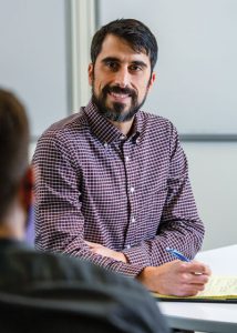 Josh Lovell in the classroom studying for Linfield's Master of Science in business