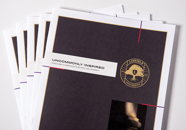 five copies of the strategic plan stacked