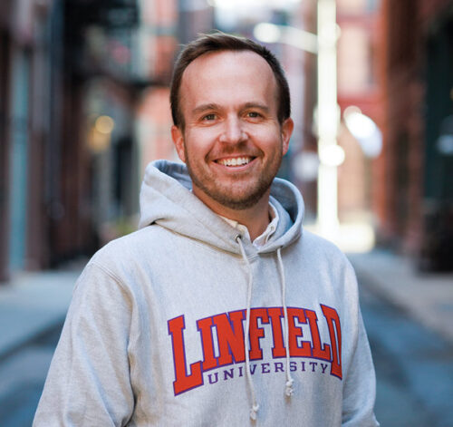 portrait of Ryan Jones '07 in a Linfield University hoodie