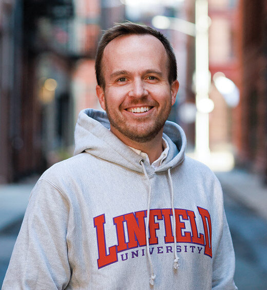 portrait of Ryan Jones '07 in a Linfield University hoodie