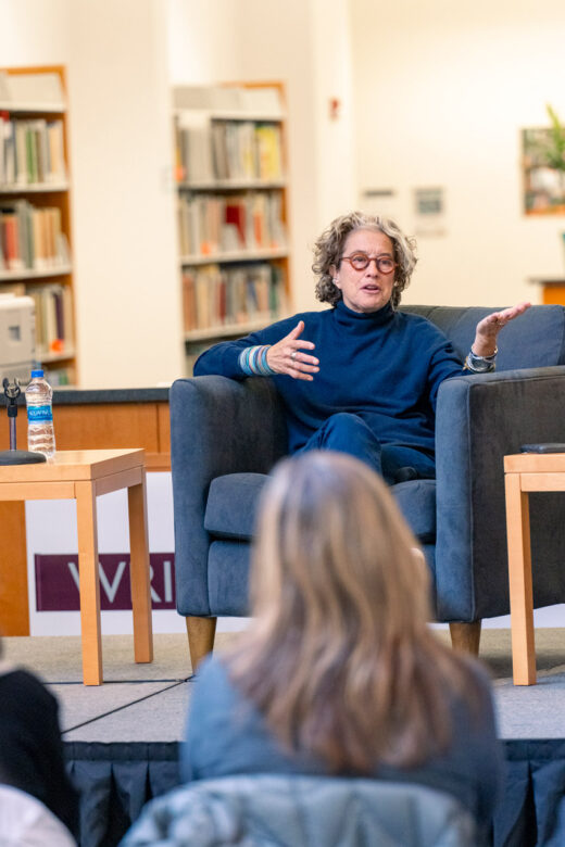 Celebrity chef Susan Feniger speaking to a group of Linfield students, faculty and staff in the library.