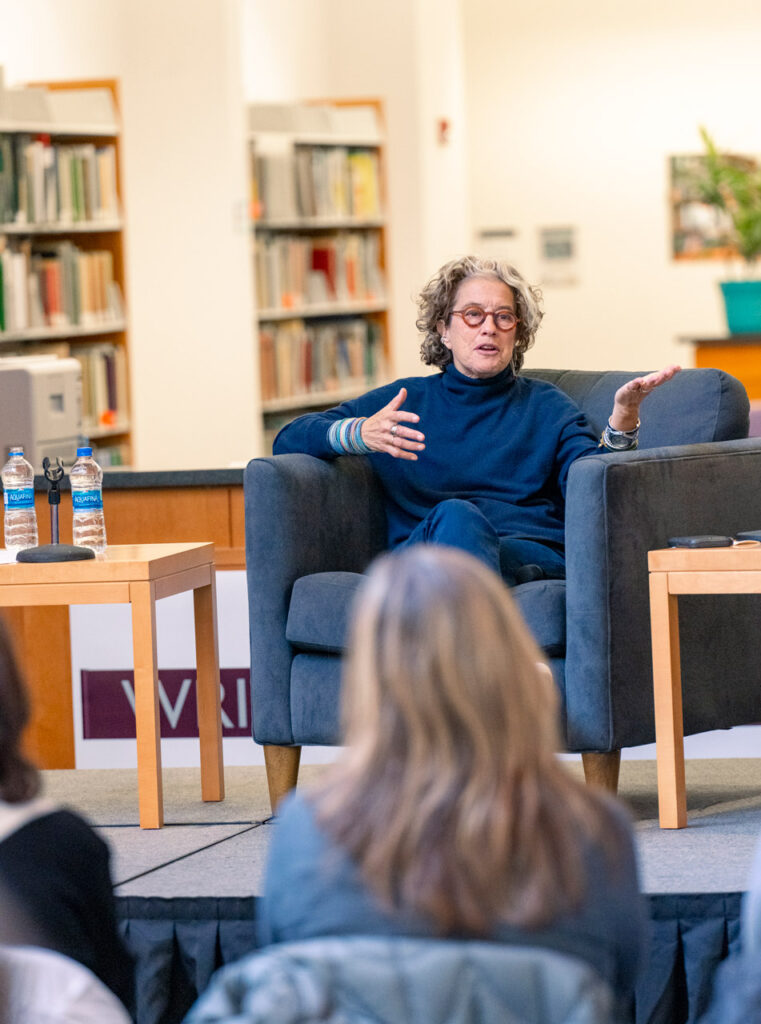 Celebrity chef Susan Feniger speaking to a group of Linfield students, faculty and staff in the library.