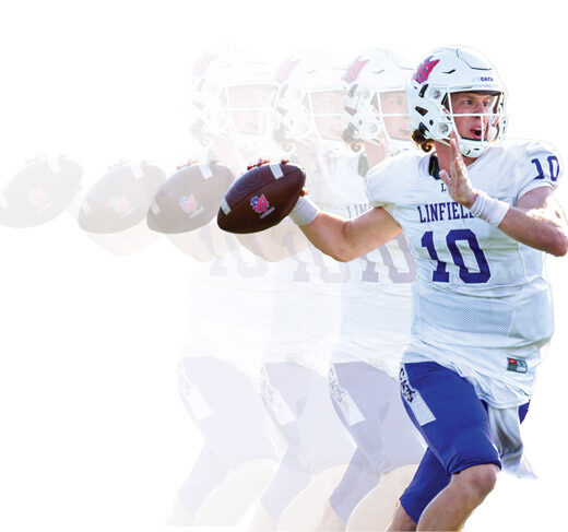 Wildcat football player throwing a pass.