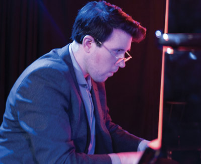Zach Gulaboff Davis '14 playing the piano.