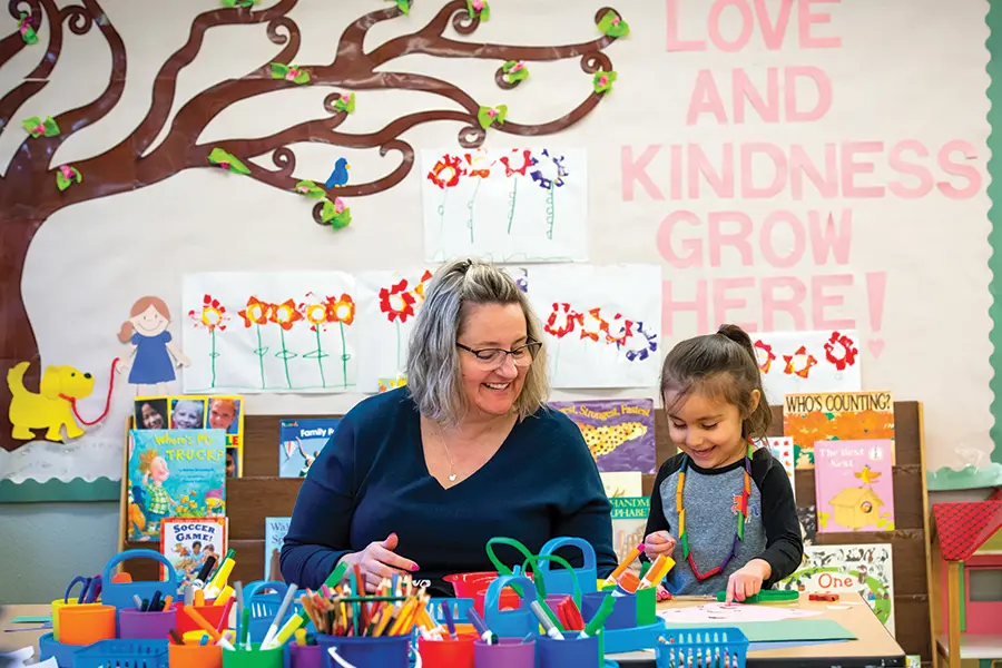 Angie Gurley teaches a pre-k student.