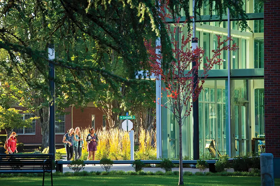 students walking in front of the WM Keck Science Center.