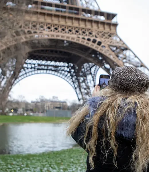 student taking a photo of the Eiffel Tower.
