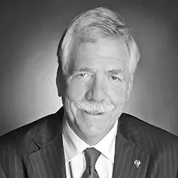 headshot of Interim President Henberg