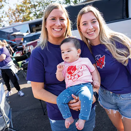 photo of a family at the Homecoming tailgate.