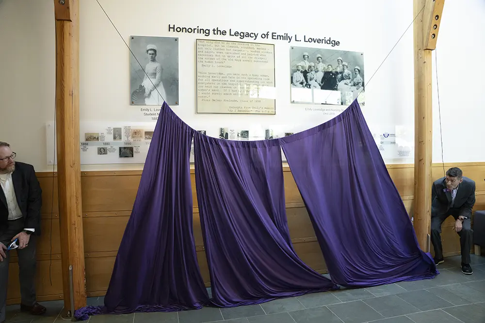 The curtain coming down to reveal the exhibit.